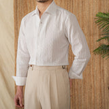 "Camisa de Manga Longa em Algodão Seersucker Budva" can be rewritten as "Camisa Longa em Algodão Seersucker Budva".