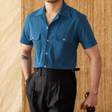 "Camisa Curta de Algodão Seersucker 'Ischia'" can be rewritten as "Camisa de Algodão Seersucker Curta 'Ischia'".