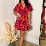Vestido Mini Skater com Estampa Abstrata em Laranja e Violeta