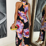 Macacão Floral em Preto e Lilás com Gola Halter