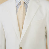 "Blazer de Algodão Seersucker Ritz" can be rewritten as "Blazer Ritz em Algodão Seersucker".