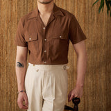 "Camisa Curta de Algodão Seersucker 'Ischia'" can be rewritten as "Camisa de Algodão Seersucker Curta 'Ischia'".