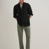 Jeans verdes slim com corte no tornozelo