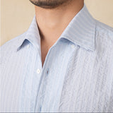 "Camisa de Manga Longa em Algodão Seersucker Budva" can be rewritten as "Camisa Longa em Algodão Seersucker Budva".