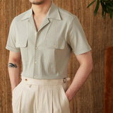 "Camisa Curta de Algodão Seersucker 'Ischia'" can be rewritten as "Camisa de Algodão Seersucker Curta 'Ischia'".