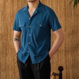 "Camisa Curta de Algodão Seersucker 'Ischia'" can be rewritten as "Camisa de Algodão Seersucker Curta 'Ischia'".