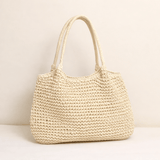 "Saco de Praia Brielle em Palha Trançada" can be rewritten as "Bolsa de Praia Brielle em Palha Trançada".