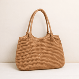 "Saco de Praia Brielle em Palha Trançada" can be rewritten as "Bolsa de Praia Brielle em Palha Trançada".