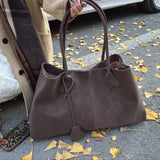 "Geanta Vegan Joan din Suede" could be rewritten as "Geanta Vegan Joan din Material Suede".