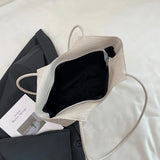 Bolsa de Mão Riona em Material Texturizado Premium